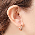 Italian Sterling Silver 3/4" Polished Square Tube Hoop 18K Rose Gold-Plate Earrings in an ear